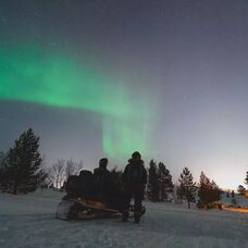 Snowmobile Hunting the Northern Lights