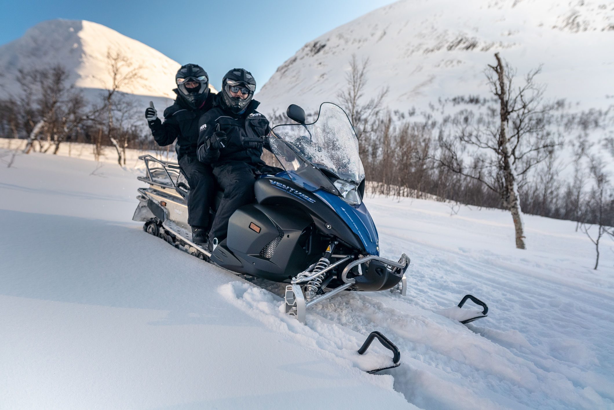 two people on snowmobile